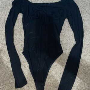 long sleeve black body suit.